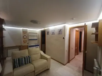 a living room with a couch and a door at Varone in Requena