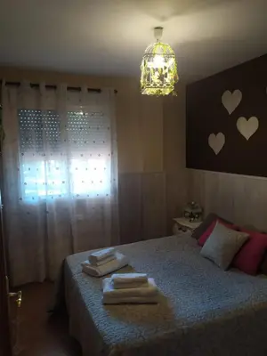 a bedroom with a bed with towels on it at Casa Tambor in Puebla de Vallbona