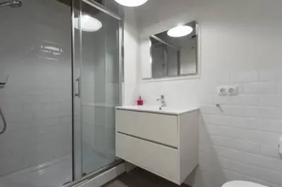 a bathroom with a shower and a sink and a mirror at Your home at Valencia, Cabañal in Valencia