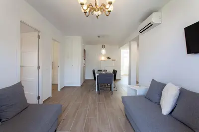 a living room with a couch and a table at Valencia Flat Rental Malvarrosa Beach zone in Valencia