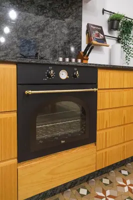 a black oven in a kitchen with a counter at SingularStays Ms Rogers in Valencia