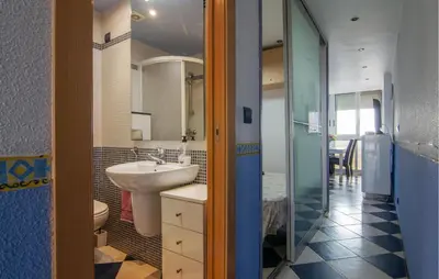 a bathroom with a sink and a toilet at One-Bedroom Apartment In La Pobla De Farnals in Puebla de Farnals
