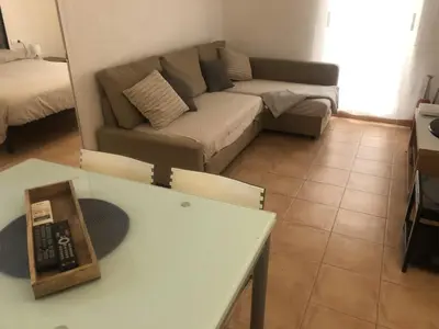 a living room with a couch and a table at Casco antiguo, el Carmen. in Valencia