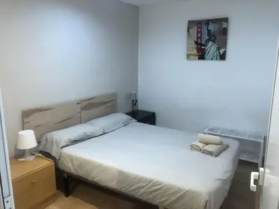 a bedroom with a bed and a picture on the wall at Casco antiguo, el Carmen. in Valencia