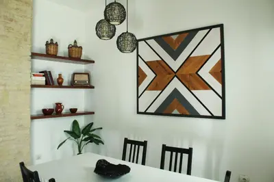 a dining room with a table and a picture on the wall at Ruzafa, centro ciudad. Terraza-wifi in Valencia