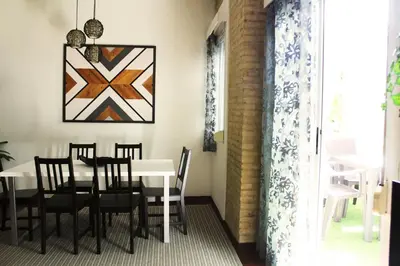 a dining room with a table and chairs at Ruzafa, centro ciudad. Terraza-wifi in Valencia