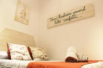 a bedroom with a bed and a sign on the wall at Ruzafa, centro ciudad. Terraza-wifi in Valencia
