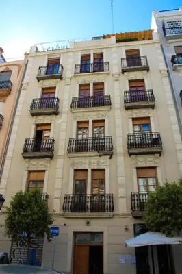 a tall building with balconies on the side of it at Ruzafa, centro ciudad. Terraza-wifi in Valencia