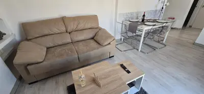 a living room with a couch and a table at Apartamento Justina in Cullera