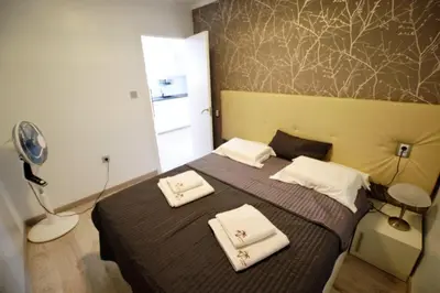 a bedroom with a bed with two towels on it at Apartamento Justina in Cullera