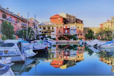 a large swimming pool with many people in it at Valencia Beach room with private bathroom coliving in Port Saplaya