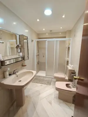 a bathroom with a sink and a shower and a toilet at el piso perfecto in Puerto de Sagunto