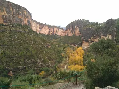 a view of a canyon with cliffs and trees at Casa Rural La Tia Rosa in Chulilla