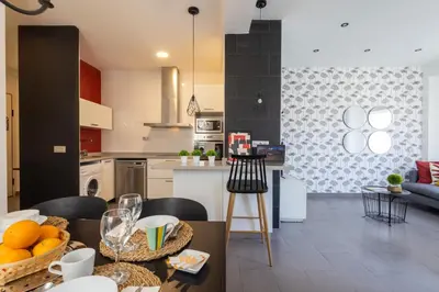 a white bathroom with a sink and a mirror at FLORIT FLATS - Stylish 2 Bedroom AC Wifi Terrace Attic in Valencia Center in Valencia