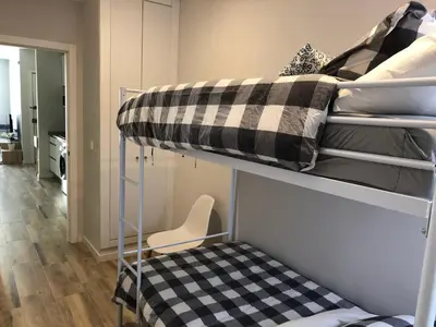 a dorm room with bunk beds with a desk at Botanic in Valencia