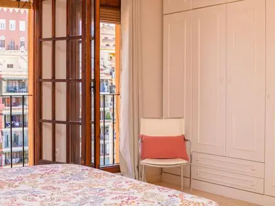a painting of a vase with flowers in it at Little Venice apartment in Alboraya