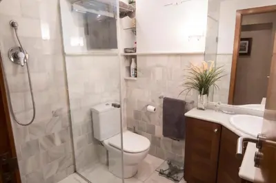 a bathroom with a toilet and a shower and a sink at Perfecto apto a orillas del mediterráneo / 4PAX in El Perellonet