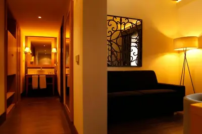 a living room with a couch and a hallway at Hotel Spa Martín el Humano in Segorbe