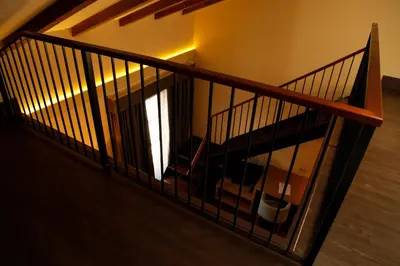 a stairway with a railing and a room at Hotel Spa Martín el Humano in Segorbe
