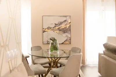 a dining room with a glass table and chairs at MD Julio Antonio in Valencia
