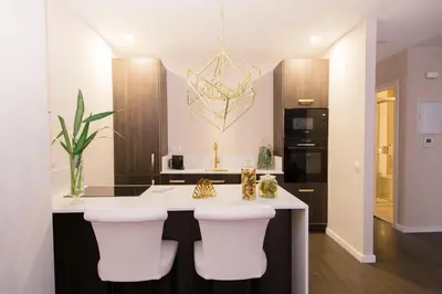 a kitchen with a island with white counter tops at MD Julio Antonio in Valencia