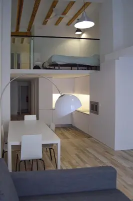 a living room with a table and a bunk bed at NWT Central Station Apartments in Valencia