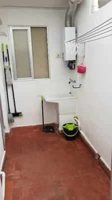 a bathroom with a sink and a tile floor at playa y relax valencia in Puerto de Sagunto