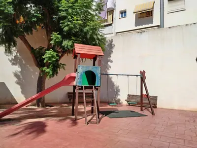 a building with two street lights in front of it at Habitación doble con baño privado, Desayuno y piscina in Alboraya