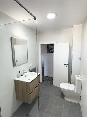 a bathroom with a sink and a toilet at Apartamento Careme in Tavernes de Valldigna
