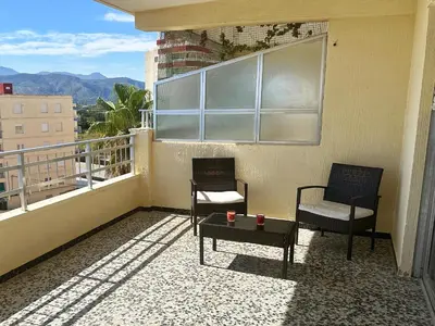 two chairs and a table on a balcony at Apartamento Careme in Tavernes de Valldigna