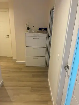 a hallway with a chest of drawers and a dresser at Apartamento de lujo en Canet de Berenguer a 150 m de la playa in Canet de Berenguer