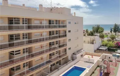 an aerial view of a building with a swimming pool at Cozy Apartment In Moncófar With Wifi in Moncófar