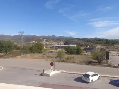 a white car parked on the side of a street at Hostal Millán in Segorbe