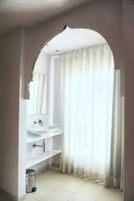 a bathroom with a sink and a window at Hotel Boutique Sabbia Valencia in Valencia