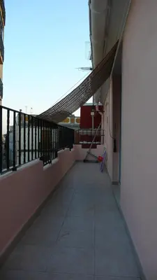 an empty hallway of a building with a balcony at Apartamento Portalet 7 in Benaguacil