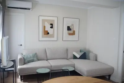 a living room with a couch and a table at TTdSSa VLC Plaza Cisneros in Valencia
