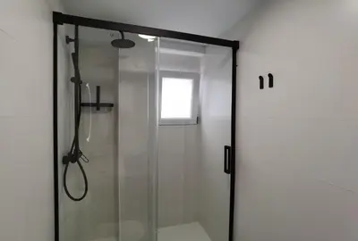 a shower with a glass door in a bathroom at TTdSSa VLC Plaza Cisneros in Valencia