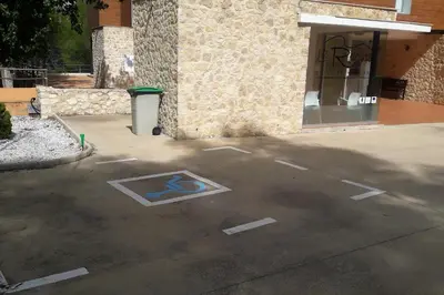 a parking lot in front of a building at Hotel de Montaña La Rocha in Quesa