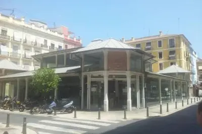 a building with motorcycles parked in front of it at Apartament in historic center in Valencia