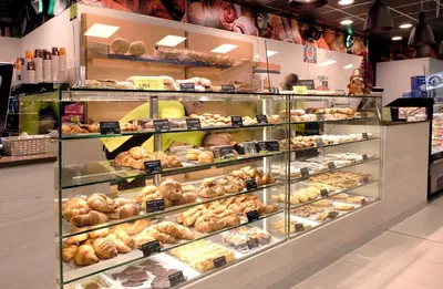 a bakery display case filled with lots of donuts at Hotel Belcaire in Vall de Uixó