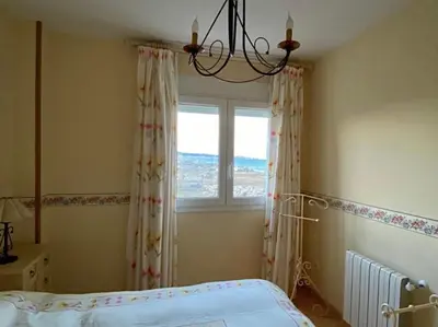 a bedroom with a bed and a window at Retiro Playa y Spa in Tavernes de Valldigna