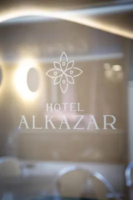 a sign for a hotel alkawi on a wall at Hotel Alkazar in Valencia