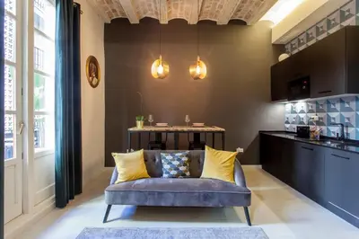 a living room with a couch and a table at Mediterranean Flats Plaza Redonda in Valencia