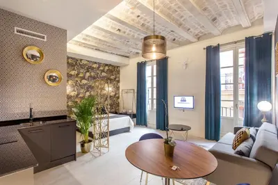 a living room with a couch and a table at Mediterranean Flats Plaza Redonda in Valencia
