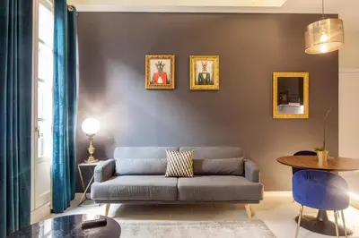 a living room with a couch and a table at Mediterranean Flats Plaza Redonda in Valencia
