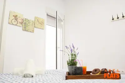 a bedroom with a bed and a window at Calle Cuenca in Valencia