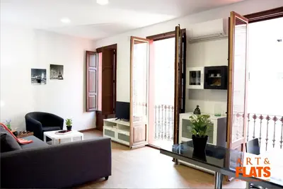 a living room with a couch and a table at Calle Cuenca in Valencia