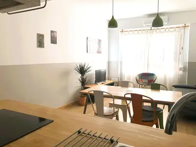 a dining room with a table and chairs at Casa Maritim Cabanyal in Valencia