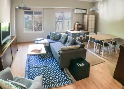 a living room with a couch and a table at KOA Centric, comfy in Ruzafa in Valencia
