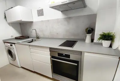 a small kitchen with a sink and a dishwasher at KOA Centric, comfy in Ruzafa in Valencia